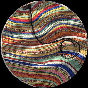 May include: Round, beaded handbag with a black strap. The bag features a colorful, striped pattern in red, orange, yellow, green, blue, and white. The beads are small and tightly packed, creating a textured surface.