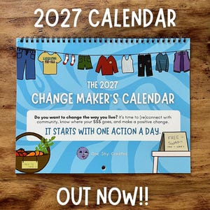 May include: A 2027 wall calendar titled The 2027 Change Maker's Calendar with a blue wavy background. It features illustrations of clothing on a clothesline, a basket of produce, and a sign reading Free Swap. Text includes It starts with one action a day.