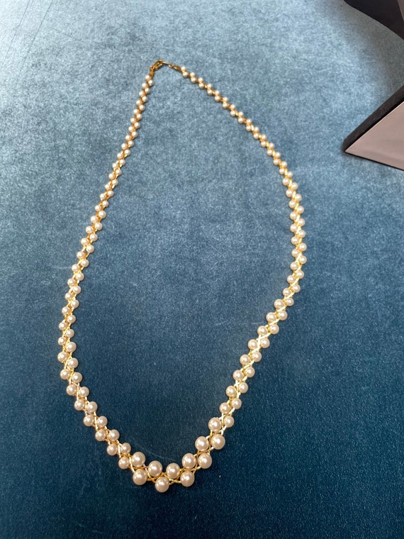 Braided faux pearl costume piece