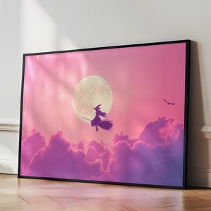 May include: A framed print of a witch flying on a broomstick in front of a full moon and pink clouds.