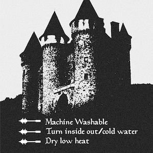 a castle with three towers, and it is described as washable, turn inside out/cold water, dry low heat, and machine washable.