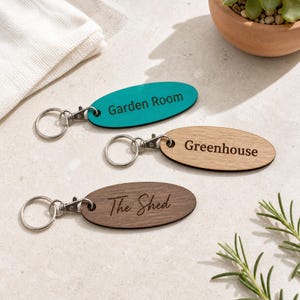 Personalised Oval Wooden Keyring, Garden Shed Studio Workshop Key Fob