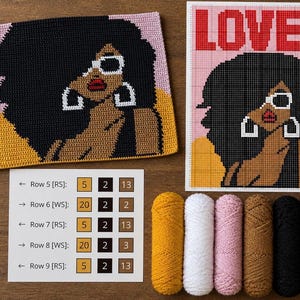 May include: A crochet project featuring a person with large black hair, white sunglasses, and hoop earrings, alongside a grid pattern chart with the word LOVE, a row-by-row instruction sheet, and five skeins of yarn in mustard, white, pink, tan, and black.