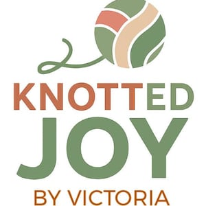 May include: A logo featuring a stylized ball of yarn in sage green, coral, and beige. Below the yarn, the text KNOTTED JOY is written in large, bold, sage green and coral letters, with the words BY VICTORIA in smaller coral text underneath.