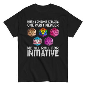 May include: Black t-shirt with a white graphic of dice and the text "WHEN SOMEONE ATTACKS ONE PARTY MEMBER WE ALL ROLL FOR INITIATIVE".