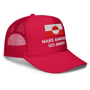 May include: Red trucker cap with a white mesh back. The front displays a Greenlandic flag patch and the embroidered text "MAKE AMERICA GO AWAY" in white. A bold and stylish statement.