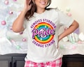 Pride Removes Stubborn Orange Stains Shirt, Funny Anti Trump LGBTQ Tee, Fuck Trump, Progressive Political Feminist T-Shirt, Pride Shirt, FDT product logo