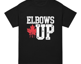 May include: Black t-shirt with white text that reads "Elbows Up" and a red maple leaf graphic.