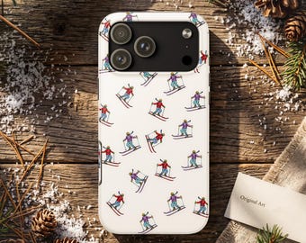 May include: A white smartphone case featuring a repeating pattern of small, colorful illustrations of skiers in red, blue, and purple jackets, each holding ski poles and gliding on skis across the surface of the protective cover.