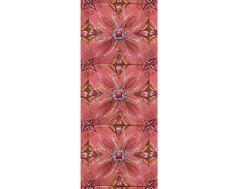 May include: A pink yoga mat with a repeating pattern of intricate floral designs in shades of orange, brown, and white.
