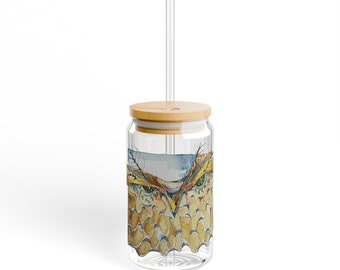 May include: A glass reusable drinking cup with a bamboo lid and a straw. The cup has a colorful owl design with a watercolor effect.