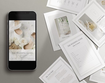 May include: A white smartphone displaying a wedding guide with the text "THE WEDDING GUIDE" and a photo of white bridal shoes and flowers.