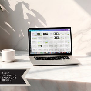May include: A laptop computer displaying a Canva design template on the screen. The laptop is on a white marble surface with a white coffee cup and saucer to the left. The text "FULLY CUSTOMISABLE IN BOTH CANVA AND INDESIGN" is at the bottom of the image.