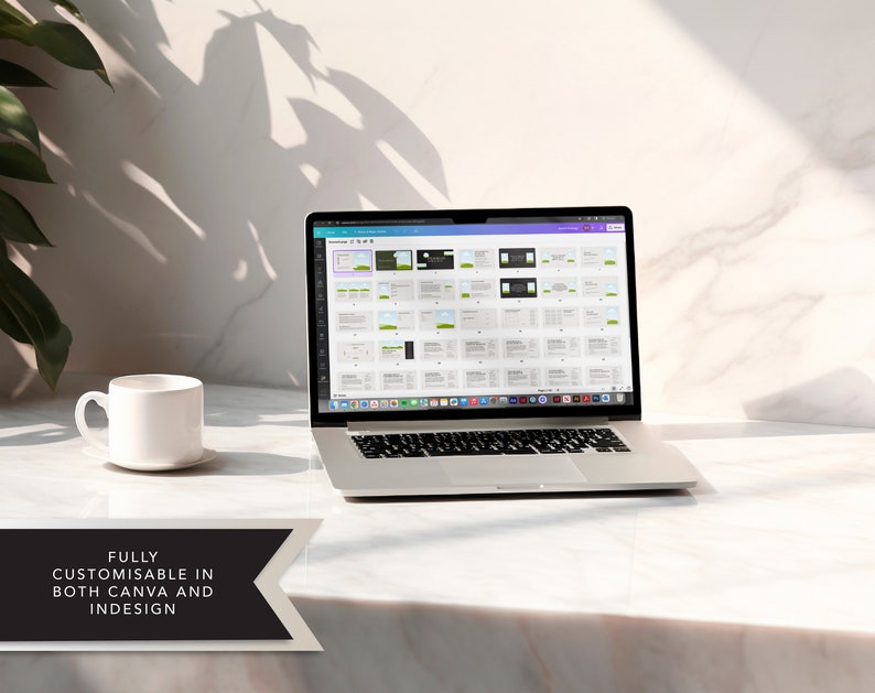 May include: A laptop computer displaying a Canva design template on the screen. The laptop is on a white marble surface with a white coffee cup and saucer to the left. The text "FULLY CUSTOMISABLE IN BOTH CANVA AND INDESIGN" is at the bottom of the image.
