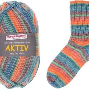 May include: A ball of Aktiv yarn and a matching sock. The yarn is a blend of orange, blue, green, and purple. The sock is knitted with the same color scheme. The yarn label reads "SUPERGARNE AKTIV 100 g / ca. 420 m."