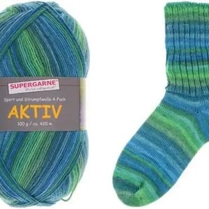 May include: A ball of blue and green yarn next to a matching sock. The yarn label reads "SUPERGARNE AKTIV 100 g / ca. 420 m". The sock and yarn have a striped pattern of blue and green.
