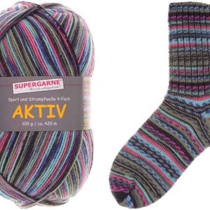 May include: A ball of Aktiv yarn and a knitted sock. The yarn is multi-colored with stripes of pink, blue, green, and black. The sock has a matching pattern. The yarn label reads "SUPERGARNE AKTIV 100 g / ca. 420 m."