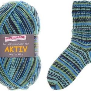 May include: A ball of blue, green, and black yarn next to a matching sock. The yarn label reads "SUPERGARNE AKTIV" and "100 g / ca. 420 m". The sock has a patterned design.