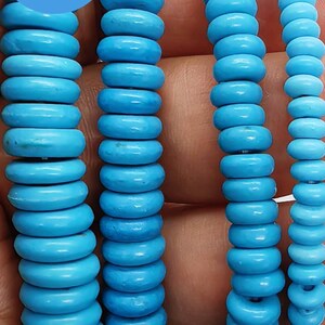 May include: Close-up of several strands of bright turquoise beads. The beads are round and uniform in size. The image includes a blue circle with the text "WK DIY Jewelry BEADS".
