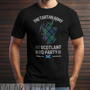 May include: A black short-sleeved t-shirt featuring a graphic of the map of Scotland filled with a green, blue, and black tartan pattern. The text reads THE TARTAN ARMY, NO SCOTLAND NO PARTY, and includes a small blue and white Scottish flag icon.