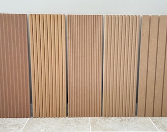May include: Five wood panels with vertical grooves. The panels are all the same size and are arranged in a row. The panels are made of a light brown wood.