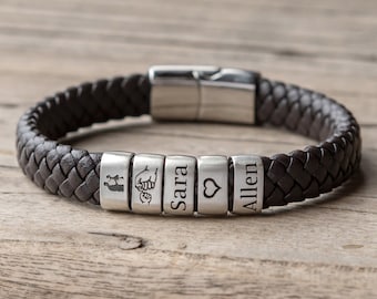 May include: Braided dark brown leather bracelet with silver beads. The beads are engraved with a family silhouette, clasped hands, a heart, and the names "Sara" and "Allen". The bracelet has a magnetic clasp.