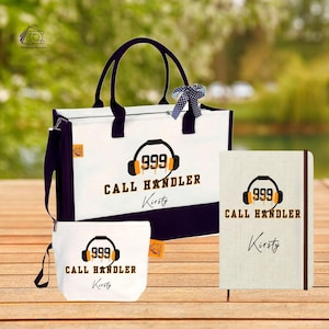 May include: A set of white and navy blue tote bag, cosmetic bag, and notebook. Each item features the text "999 CALL HANDLER" with a headset graphic and a name. The tote bag has black handles and a shoulder strap.