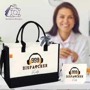 May include: A white and black tote bag and matching pouch with the text "999 DISPATCHER" and a headset graphic. The bag has black handles and a black bottom. A woman is blurred in the background.