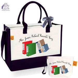 May include: A white canvas tote bag with black handles and a black trim. The bag has a zipper closure and a removable pouch. The bag is decorated with a colourful illustration of binders and the text "Mrs Jones School Records' Bag".