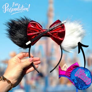 May include: A pair of black and white faux fur Minnie Mouse ears with a red metallic bow and a black glitter bow tie. The ears are on a black headband. The ears are shown with a blue and pink sequin bow with the word "Love" in pink letters.
