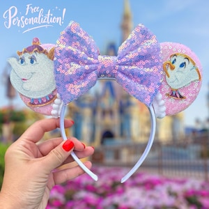 May include: A white headband with pink sequined ears featuring cartoon characters and a large purple sequined bow. The ears depict a teapot and teacup. The text "Free Personalization!" is in the upper left corner.