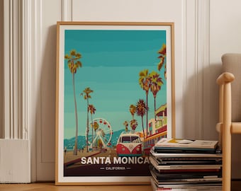 May include: A framed print of a colorful illustration of Santa Monica, California. The print features palm trees, a Ferris wheel, and a red and white Volkswagen van. The text "Santa Monica - California" is at the bottom of the print.