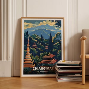 May include: A vintage travel poster featuring a colorful illustration of a temple in Chiang Mai, Thailand. The poster has a blue, green, and orange color scheme and depicts a mountain range in the background.
