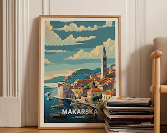 May include: A vintage travel poster featuring a colorful illustration of Makarska, Croatia. The poster depicts a seaside town with a tall church tower, buildings, and boats in the harbor. The text "Makarska - Croatia" is printed at the bottom of the poster.