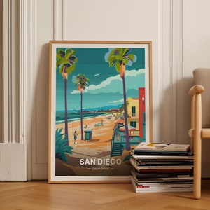 May include: A framed illustration of a beach scene in San Diego, California. The illustration features palm trees, a beach, and buildings in a colorful, stylized design. The text "SAN DIEGO - CALIFORNIA -" is at the bottom of the illustration.