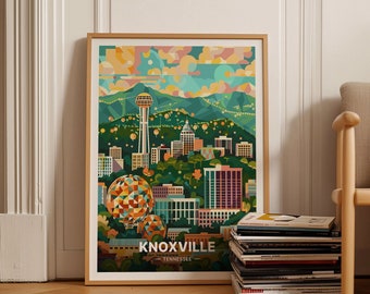 Może przedstawiać: Oprawiony wydruk artystyczny przedstawiający kolorową ilustrację Knoxville w stanie Tennessee. Grafika przedstawia panoramę miasta, w tym Sunsphere i inne zabytki, z tekstem "KNOXVILLE - TENNESSEE" na dole. Wydruk jest w drewnianej ramie.