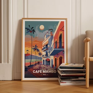 May include: A colorful illustration of Cafe Mambo in Ibiza, Spain. The image features a building with a balcony, palm trees, and a beach scene in the background. The text "Cafe Mambo - Ibiza" is at the bottom of the image.
