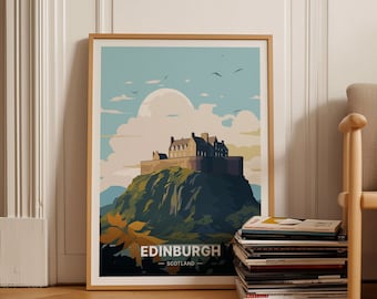 May include: A framed poster with a vintage travel illustration of Edinburgh Castle in Scotland. The poster features a blue sky with white clouds, a green hill, and a brown castle with a white roof. The text "EDINBURGH - SCOTLAND" is at the bottom of the poster.