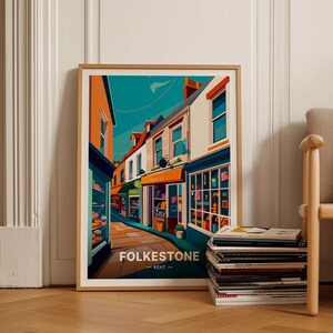 May include: A colourful illustration of a street scene in Folkestone, Kent. The image features a narrow street lined with colourful buildings and shops. The buildings are painted in shades of orange, yellow, blue, and green. The street is paved with cobblestones and there are trees and plants growing along the sides of the street.