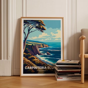 May include: Framed art print featuring a coastal landscape with a tree in the foreground. The artwork depicts a blue ocean, cliffs, and a path. The text "CARPINTERIA BLUFF - CALIFORNIA" is at the bottom. The frame is light brown.