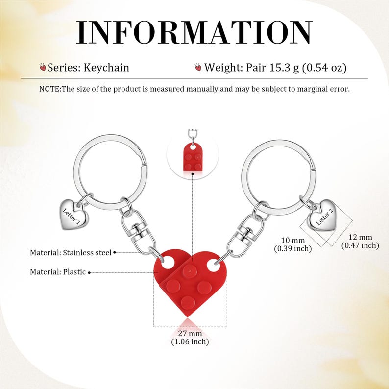 May include: A pair of red and silver interlocking heart keychains. The heart is made of plastic and features a Lego-like design. The keychains are made of stainless steel and have small charms that say "Letter 1" and "Letter 2".