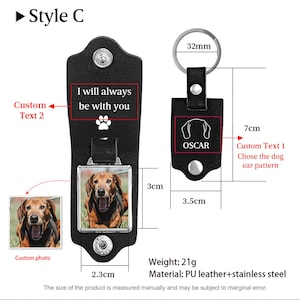 May include: A black leather keychain with a metal ring and a rectangular photo insert featuring a dog. The keychain includes a flap with the text I will always be with you and a paw print. Dimensions are 3.5cm by 7cm, with a 32mm ring and 21g weight.