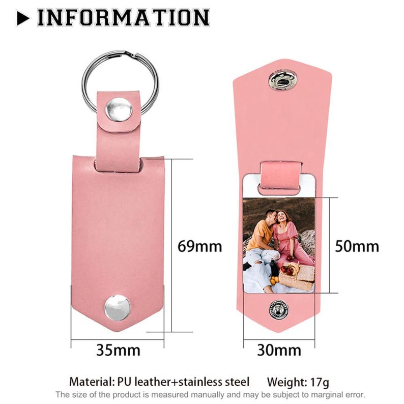 May include: A pink rectangular keyring with a silver metal ring and snap button closure. The keyring measures 69mm by 35mm, with a 50mm by 30mm internal photo display area. It is made of PU leather and stainless steel, weighing 17g.