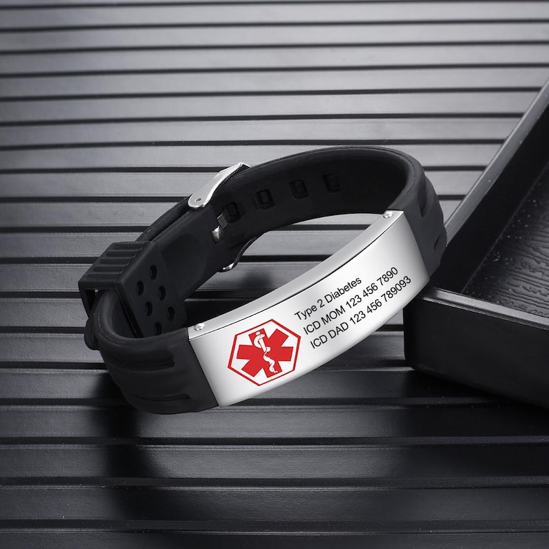 May include: Black silicone bracelet with a silver metal plate engraved with a red medical symbol and the text "Type 2 Diabetes, ICD MOM 123 456 7890, ICD DAD 123 456 78903".
