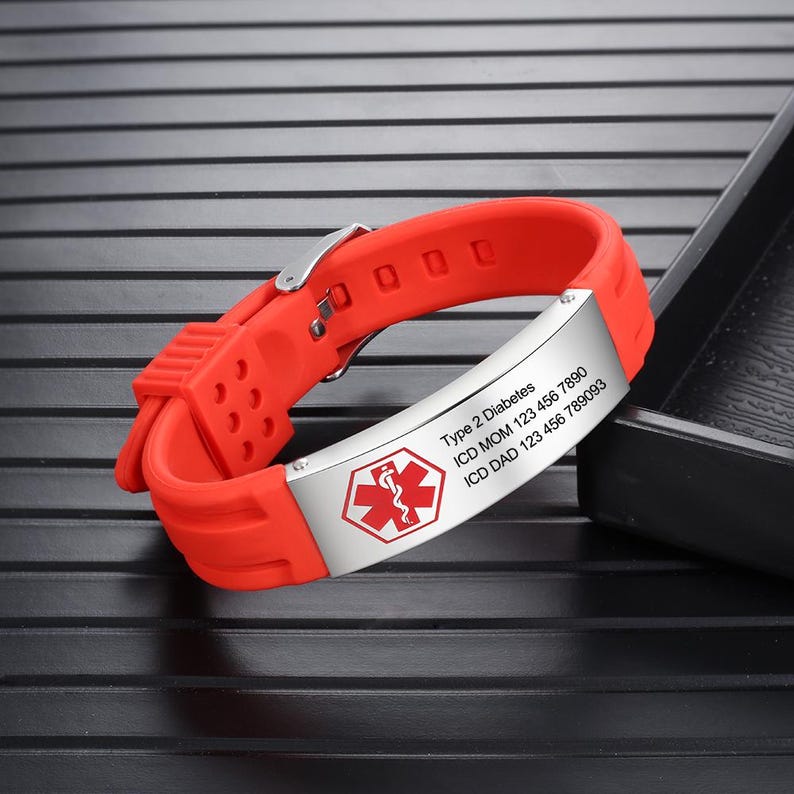 May include: Red silicone medical alert bracelet with a silver metal plate engraved with "Type 2 Diabetes", "ICD MOM 123 456 7890", "ICD DAD 123 456 789083" and a medical symbol.