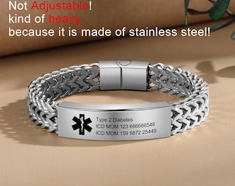 May include: A silver stainless steel medical alert bracelet with a black engraved plate that reads "Type 2 Diabetes", "ICD MOM 123 666686548", and "ICD MOM 159 5872 25449". The bracelet has a silver clasp.