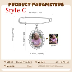 May include: A silver-toned brooch featuring an oval pendant with an ornate filigree frame containing a photograph of a person in a pink shirt. The brooch measures 2.17 inches in length, with the pendant measuring 1.52 by 1.12 inches and weighing 0.30 oz.