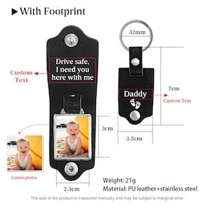 May include: A black leather keychain featuring a metal frame for a custom photo, a snap closure, and a metal ring. The keychain displays the text "Drive safe, I need you here with me" and "Daddy" with footprint icons. Dimensions are 3.5cm by 7cm.