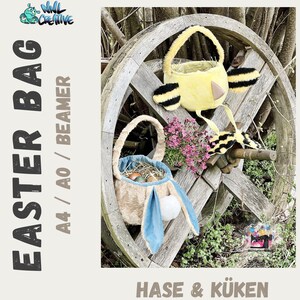 May include: Two Easter baskets, one shaped like a bunny and the other like a chick, are displayed on a wooden wheel. The bunny basket is brown with blue ears and a white pom-pom. The chick basket is yellow with black stripes and a beak. The text "Hase & Küken" is visible at the bottom of the image.