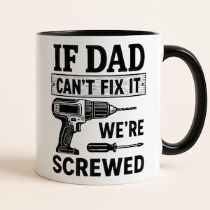 May include: White ceramic mug with a black interior and handle. The mug features the text "IF DAD CAN'T FIX IT WE'RE SCREWED" in black, with illustrations of a drill and screwdriver.